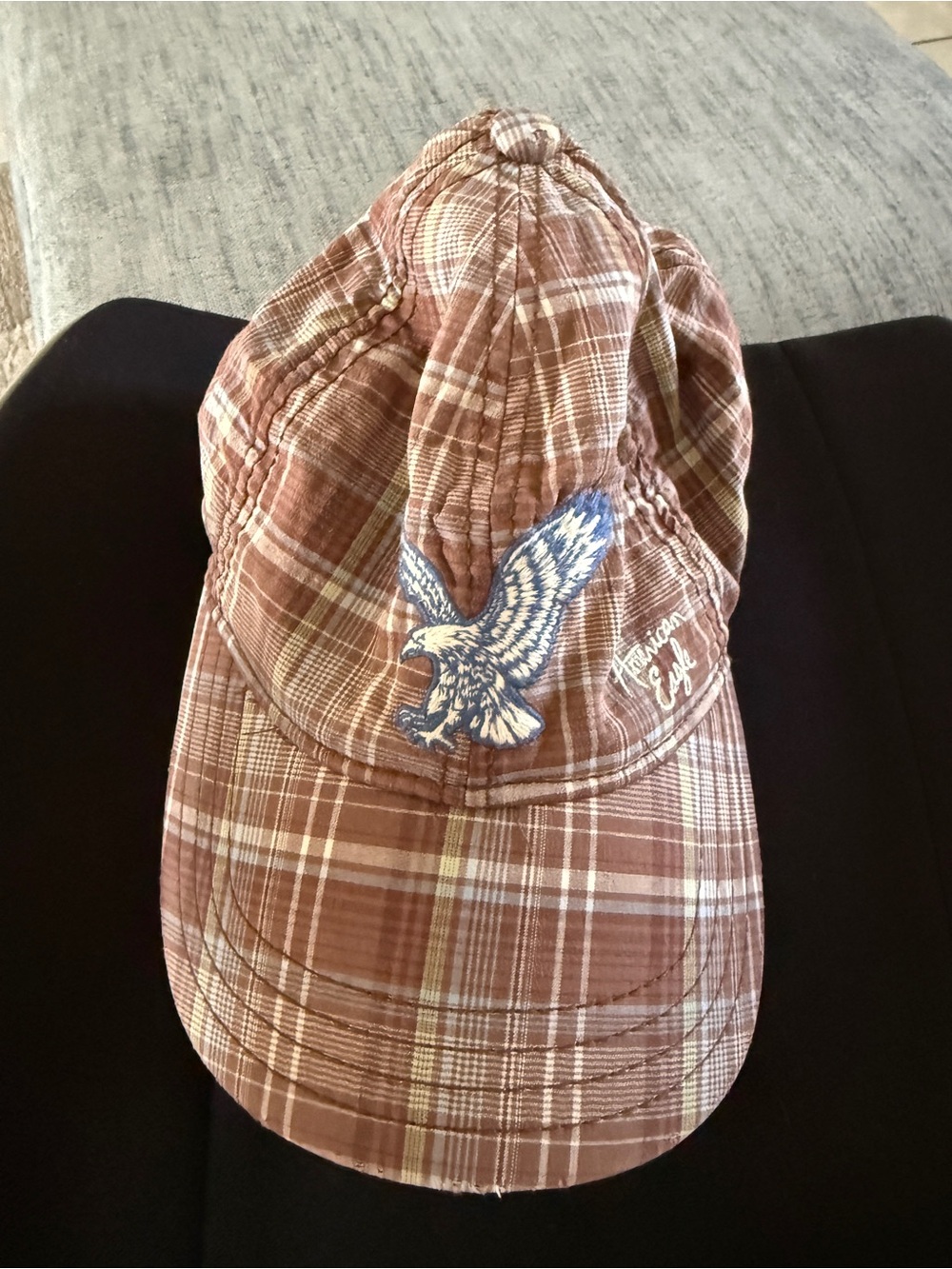 American Eagle brown, and beige plaid baseball cap